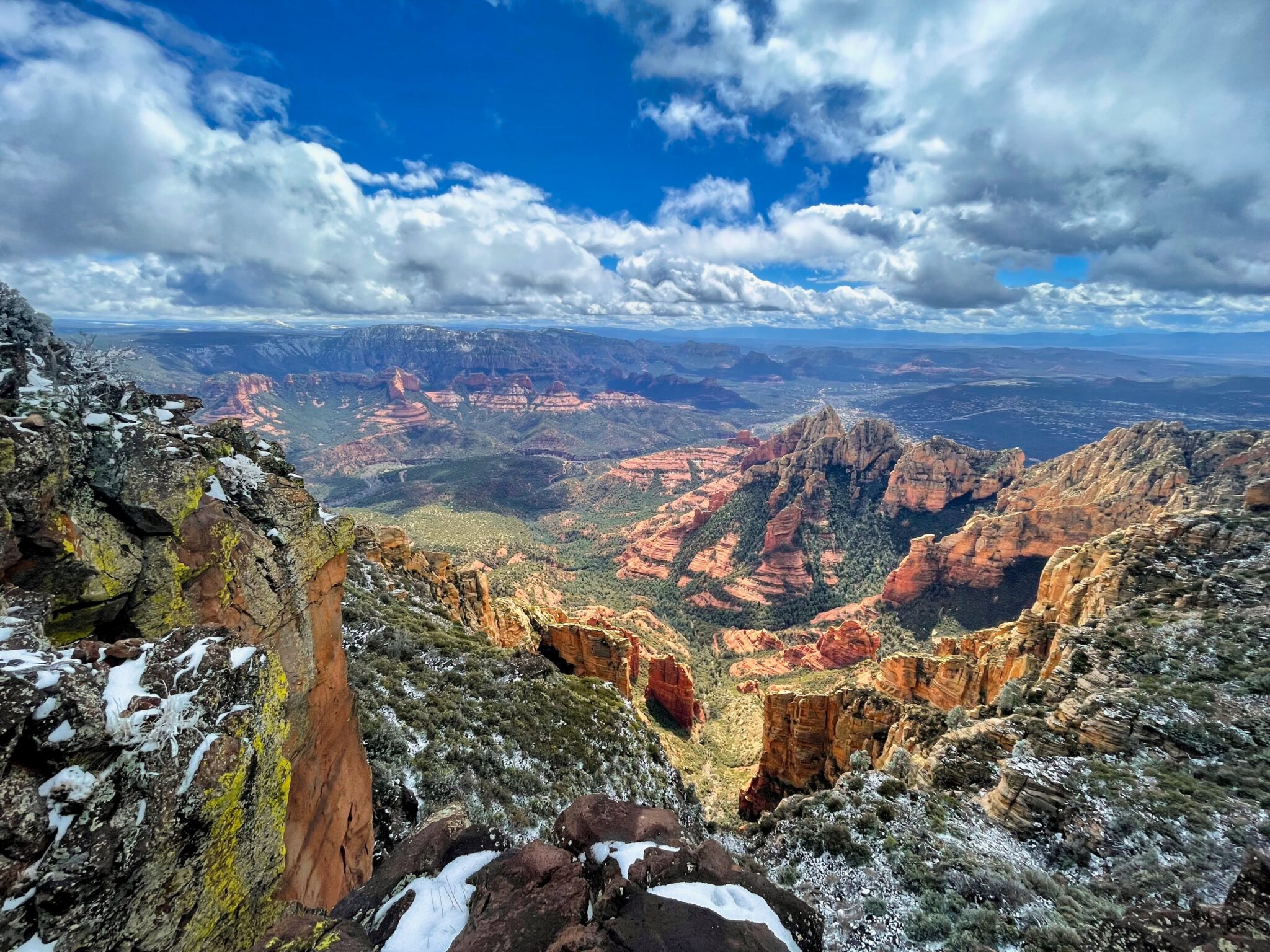 Sweeping view over Sedona's red rock canyons with light snow