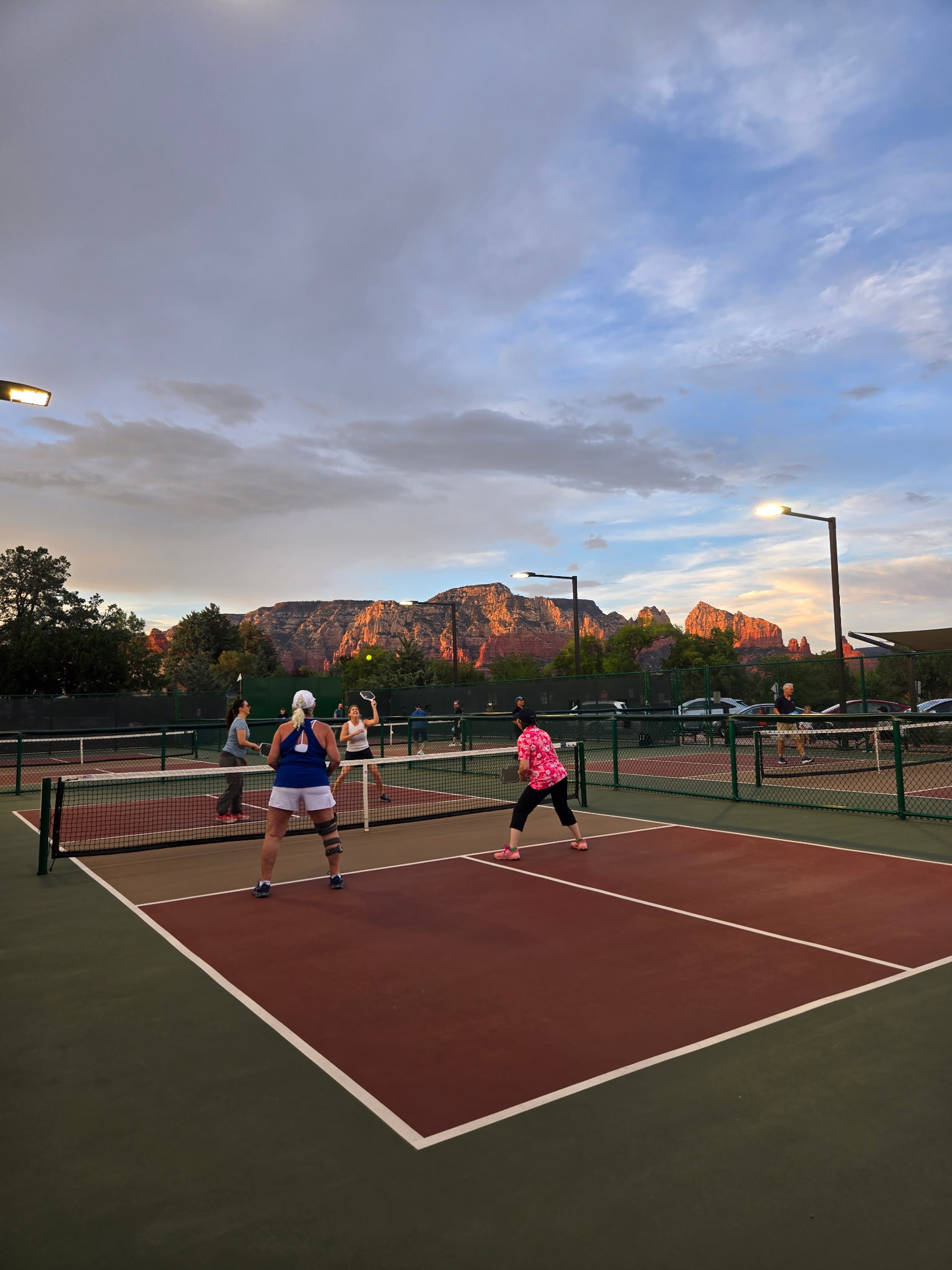 Evening pickleball under the Sedona red rocks at sunset
